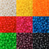 A collection of jelly beans in various colours, including white, yellow, orange, red, blue, green, pink, purple, and black.