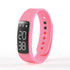 A pink Endurance Pedometer MKII with a digital display showing step and calorie counts.