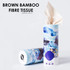 A cylindrical container of brown bamboo fibre tissue with an artistic blue and white design, featuring a logo.