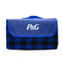 A folded picnic blanket in blue and black checkered pattern, featuring a solid blue flap with a logo.