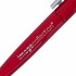 A red metal pen with a silver clip and a logo on the side.