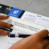 A ruler with a transparent edge and a logo, placed above a calendar and a document titled "Indigenous Community Engagement Strategy."