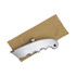 A silver cutter with a textured handle resting on a piece of brown paper. The item has a brand logo.