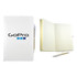 A white recycled notebook with a pen, featuring a logo, showing lined pages inside.