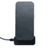 A black wireless charger with a phone positioned on top, connected by a cable at the base.