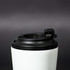 A travel mug featuring a white body and a black lid, with a logo visible on the surface.