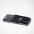 A black silicone phone wallet with popper buttons on a grey smartphone, featuring a logo.