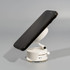 A white vacuum suction magnetic phone stand holding a black smartphone at an angle.