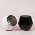 A detachable wine glass in black and white, featuring a sleek design with a shiny interior and matte exterior.