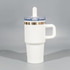A double wall mug in white with a clear lid and blue straw, featuring a handle and a silver band.