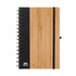 A bamboo notebook with a black textured cover and a black elastic band. Features a spiral binding and a logo.