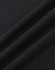 A close-up of a black premium cotton fabric, showcasing its smooth texture and soft feel.