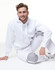 A white fleecy hoodie with a front pocket, featuring a logo, worn with matching light grey pants.