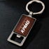 A drink bottle opener keyring featuring a square wooden design and a silver metal keyring, with a logo.