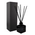 A black square reed diffuser with black reeds and a matching box. Stylish and minimalistic design for home décor.
