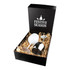 A stainless steel wine glass with a sleek design, presented in a black gift box with festive decorations and straw filling.