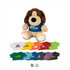 A plush dog toy in brown and cream, wearing a blue shirt with a logo, surrounded by colourful miniature shirts.