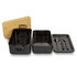 A black expandable lunch box with a bamboo lid, featuring two compartments and cutlery inside.