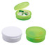 Earbuds stored in a round green case, with an additional plain white case shown. Both cases are compact and portable.