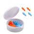 A white case containing two pairs of earplugs, one orange and one blue, with additional blue earplugs displayed above.