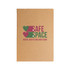 A kraft notebook featuring a logo with hearts and the text "Safe Space Mental Health & Wellness Clinic" in green and pink.