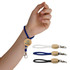A hand holds a blue cord keytag with a wooden circular attachment, alongside black and white keytags.