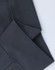A close-up of grey oversized fleece hoodie cuffs with a textured ribbed finish and visible stitching.