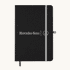 A black A5 notebook with an elastic closure and a logo on the front, featuring a grey band and bookmark.