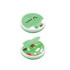 A green and white pill box with multiple compartments containing various capsules and tablets.
