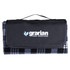A picnic blanket in grey and black, folded with a carrying handle and a logo on the front.