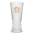 A tall, clear beer glass with a branding logo. The glass features a tapered design.