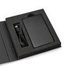 A black solid-state power bank with a USB cable, displayed in a black presentation box.