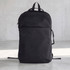 A black backpack with a sleek design and a front pocket, featuring straps and a logo on the side.
