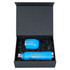 A blue drink bottle and a matching accessory are placed inside a black magnetic gift box filled with black tissue paper.