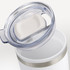 A double wall cup in white, with a clear lid and silver band. The lid features a sliding opening for drinking.