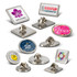 A collection of round and square lapel pins in various colours, featuring different designs and logos.
