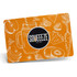 An orange promotional place mat featuring illustrations of fruits and vegetables, along with a logo in the centre.