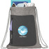 A grey drawstring bag with a front pocket, featuring a logo, and various items peeking out from the top.