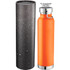 A drink bottle in vibrant orange, with a silver lid, and a textured black protective case. Features a logo.