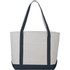A heavy-weight cotton tote bag in cream with navy blue straps and base, featuring a large main compartment and one external pocket.
