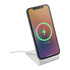A wireless charging stand in white, holding a smartphone displaying a charging indicator.