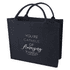 A navy blue tote bag with two handles and a logo, featuring the phrase "You're capable of amazing things."