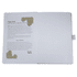 An open journal book featuring a textured white cover, showcasing a page with an artistic design and text.