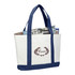 A large white tote bag with navy blue handles and bottom, featuring a decorative logo and filled with magazines.