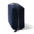 A navy blue rectangular tech kit with a sturdy zipper and branding on one side.