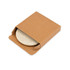 A wireless charger in a brown cardboard box, partially revealed with a textured surface. It has a minimalistic design.
