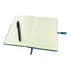 A blue premium notebook with lined pages, accompanied by a pen, featuring a ribbon bookmark and a logo on the side.