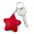 A red star-shaped key ring attached to a silver key, featuring a simple design.