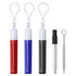 A set of retractable metal straws in red, blue, and black with a cleaning brush and keychain attachments.