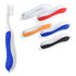 A toothbrush with a blue grip alongside toothbrushes in red, orange, black, and white. Each has a textured handle.